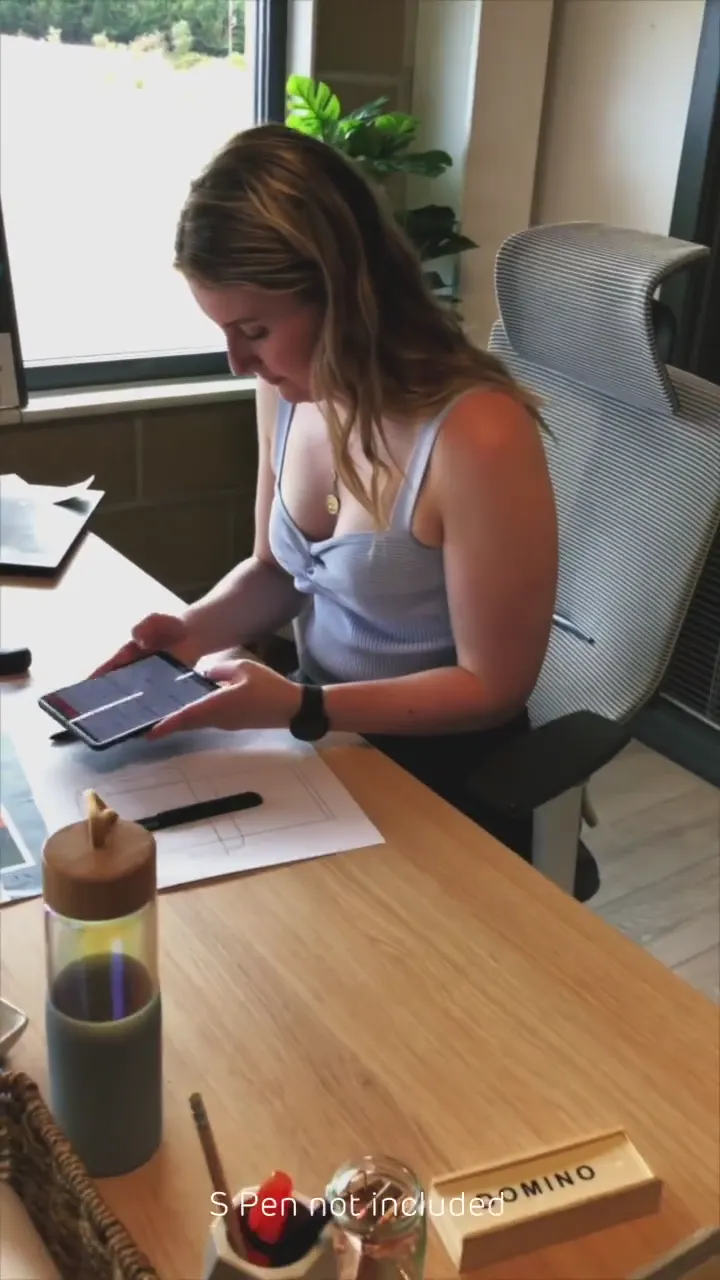 Woman using a Samsung Galaxy Z Fold at a café table
